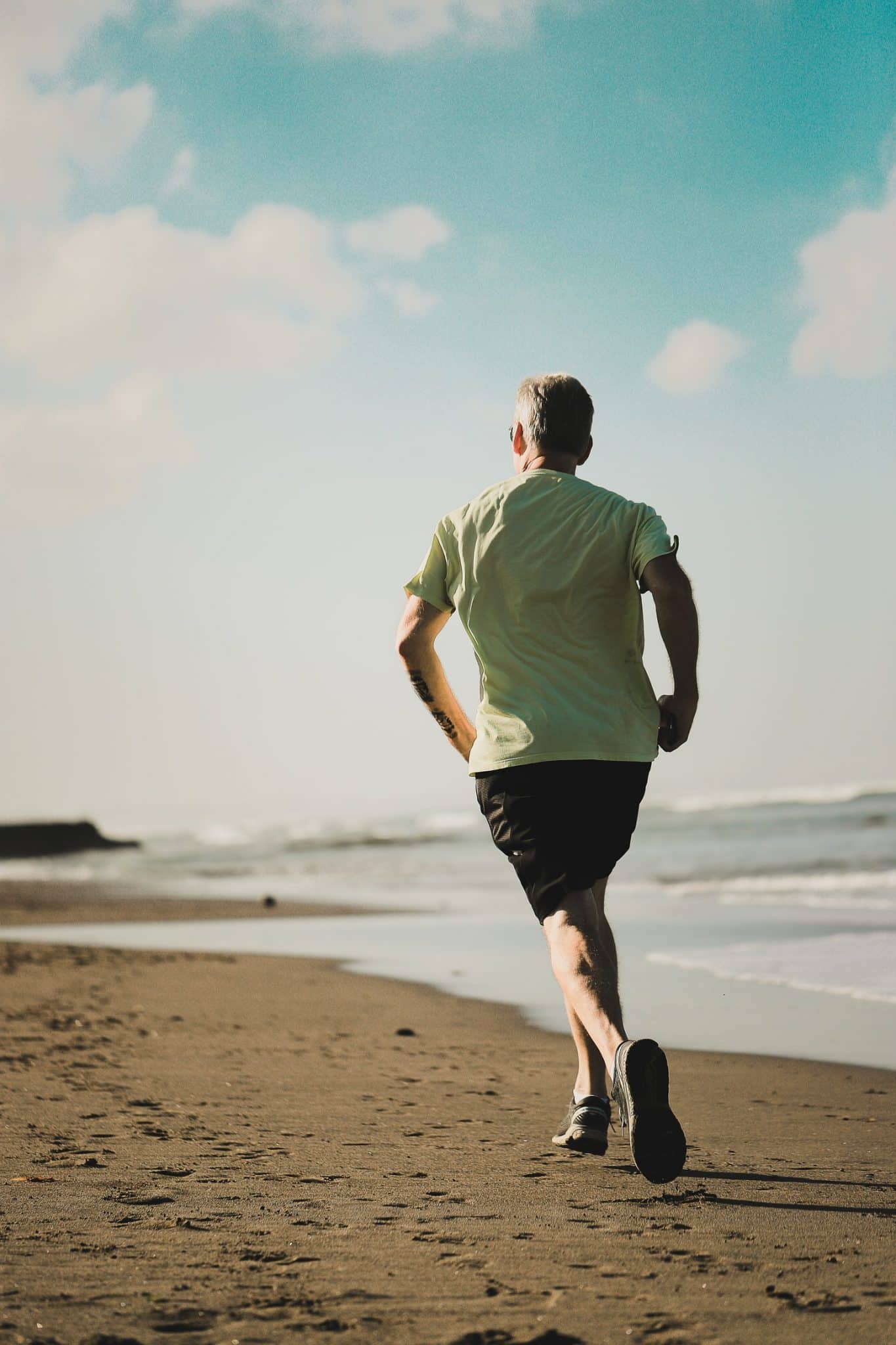 Man running on the beach.