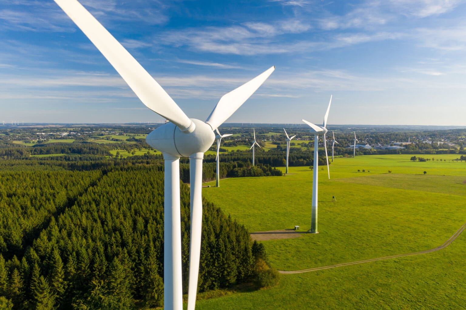 Shot of large industrial windmills in the countryside